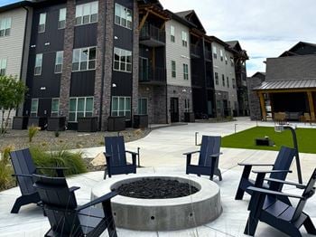 Outdoor entertainment area with fire pit, activity lawn & hammock garden